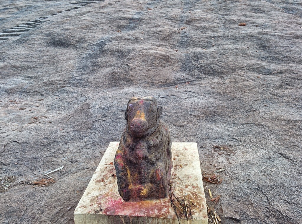A bull guarding the entrance to a smaller temple